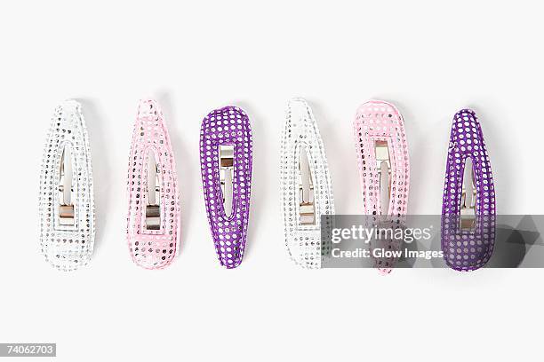 close-up of a group of hair clips in a row - hair clip stock pictures, royalty-free photos & images