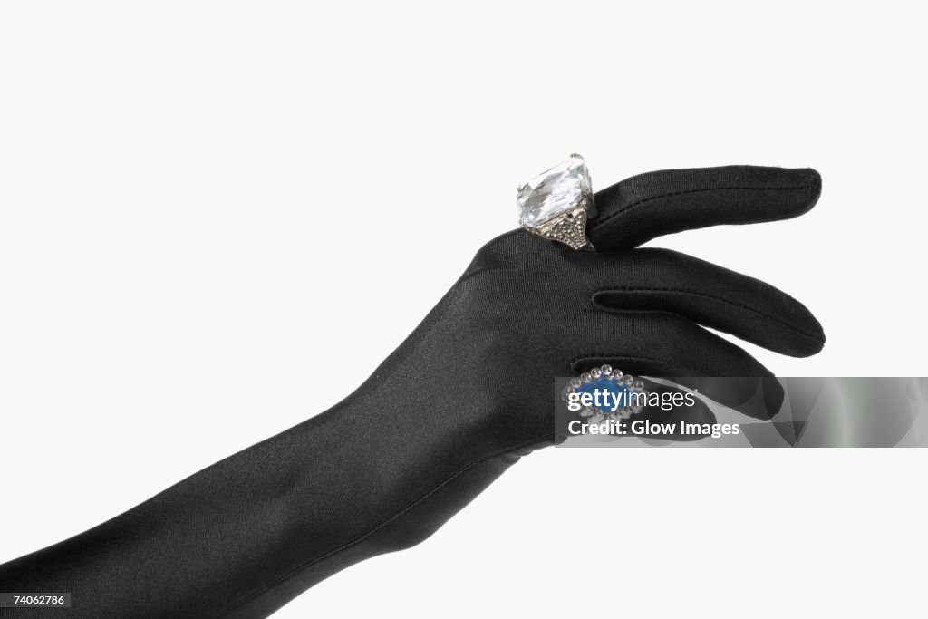 Close-up of a person's hand with two rings