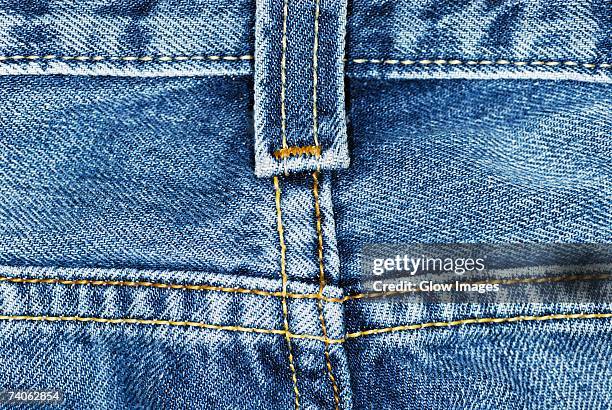 close-up of a belt loop on a pair of jeans - belt loop stock pictures, royalty-free photos & images