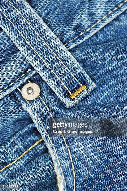 close-up of a belt loop on a pair of jeans - riemlus stockfoto's en -beelden