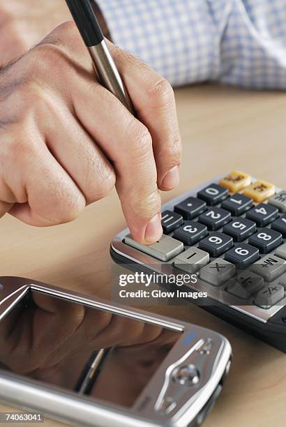 Hand Calculator Math 132 Fingers Holding Calculator Stock Photos, High-Res Pictures, and ...