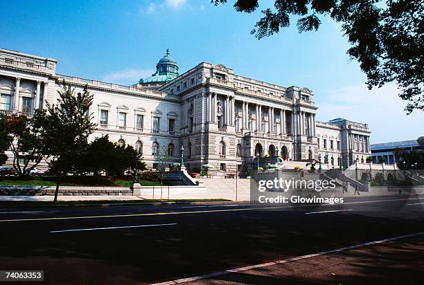government building beside a road, library of congress, washington dc, usa - library of congress stock pictures, royalty-free photos & images