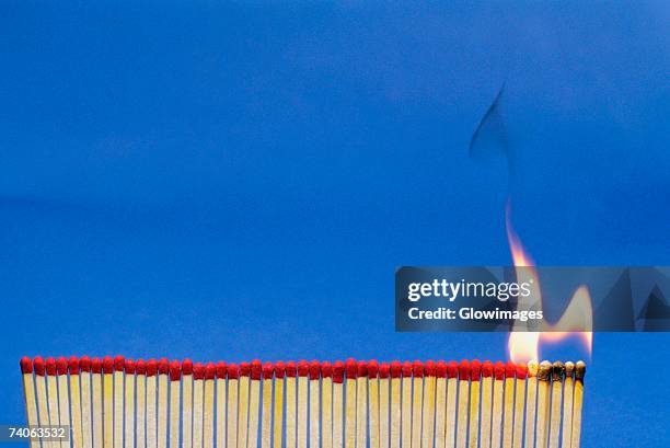 close-up of matchsticks burning - matchstick stock pictures, royalty-free photos & images