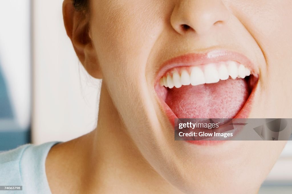 Close-up of a young woman with her mouth open