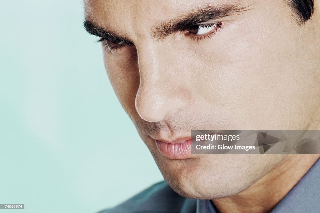 Close-up of a young man looking serious