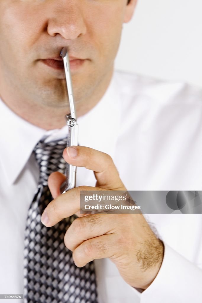 Close-up of a businessman holding a mobile phone