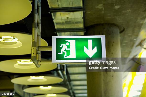 close-up of an emergency exit sign at an airport, madrid, spain - 非常口 ストックフォトと画像