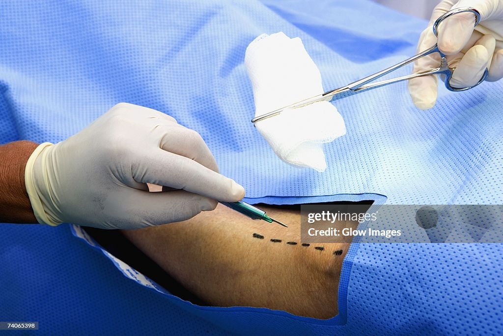 Close-up of two surgeons operating a patient