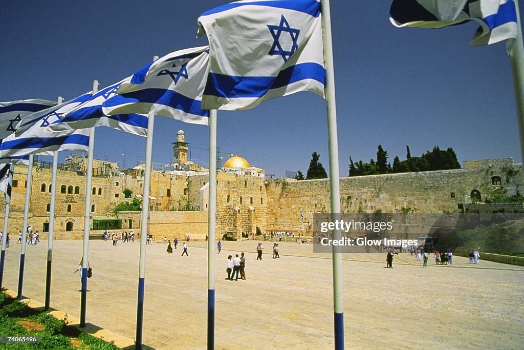 Israeli flags at a shrine and a dome in the background, Wailing Wall, Dome Of The Rock, Jerusalem, Israel