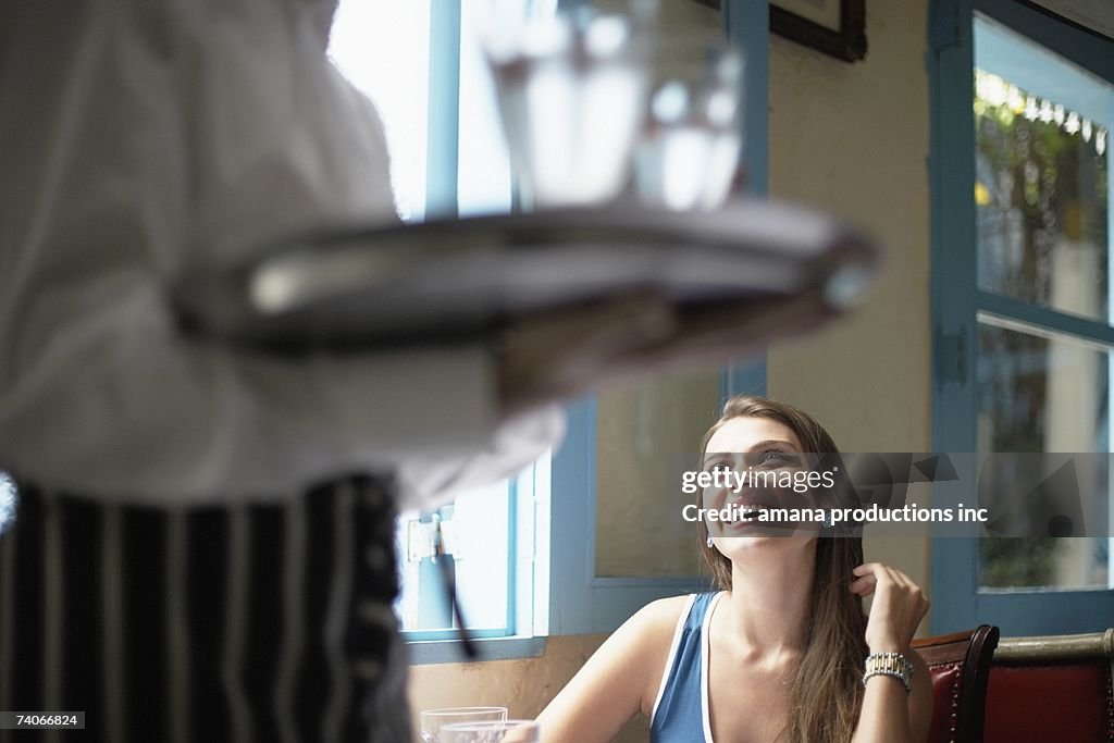 Waiter near female customer