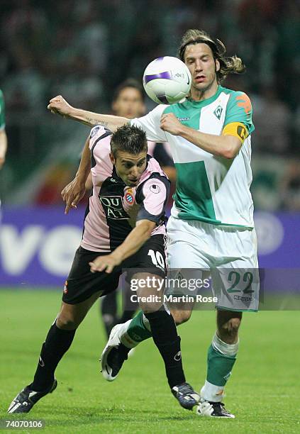 Luis Garcia of Espanyol and Torsten Frings of Bremen fight for the ball during the UEFA Cup semi-final, 2nd leg match between Werder Bremen and...