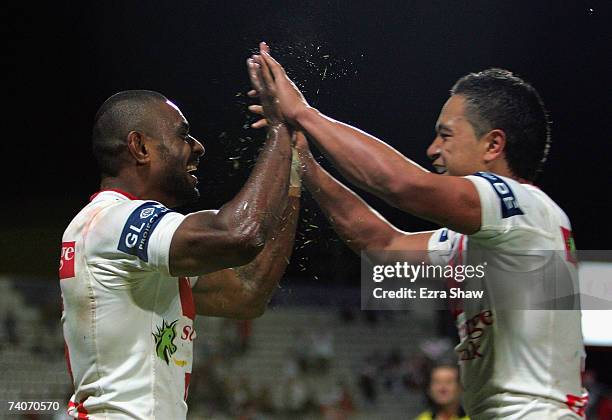 Wes Naiqama of the Dragons is congratulated by teammate Chase Stanley after Naiqama scored a try against the Panthers during the round eight NRL...