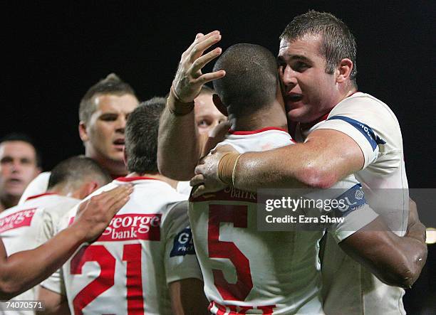 Wes Naiqama of the Dragons is congratulated by teammate Justin Poore after Naiqama scored a try against the Panthers during the round eight NRL match...