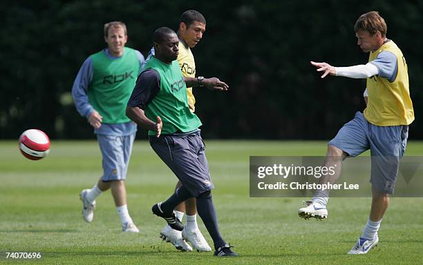 Teddy Sheringham shoots at goal past Alex Dyer and Hayden Mullins during West Ham United Training session at their Chadwell Heath Training Ground on...