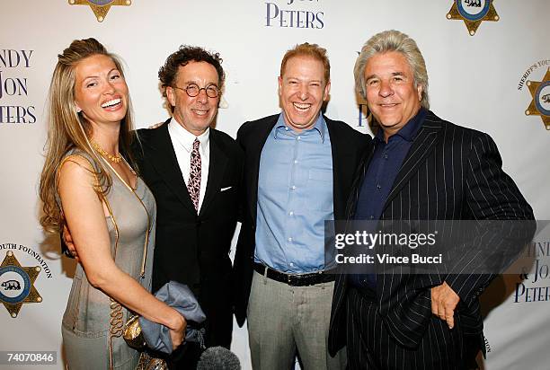 Producer Mark Canton and Ryan Kavanaugh, CEO, Relativity Media pose with producers Mindy Peters and Jon Peters at the Los Angeles County Sheriff's...