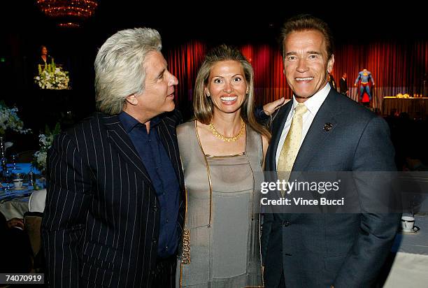 Producers Jon and Mindy Peters pose with California governor Arnold Schwarenegger at the Los Angeles County Sheriff's Youth Foundation's annual...