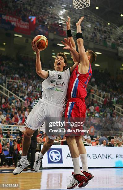 Jiri Welsch of Unicaja jumps to score a basket as David Andersen of CSKA Moscow tries to block during the EuroLeague Final Four Semi Final match...