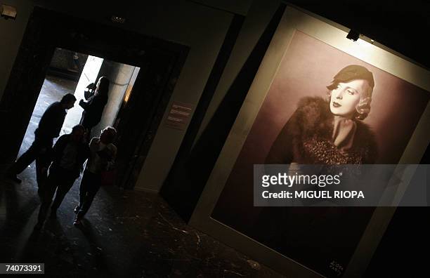 Visitors looks at a portrait of the painter Tamara de Lempicka during an exhibition 04 May 2007 in Vigo. Lempicka captured the essence of modernism...