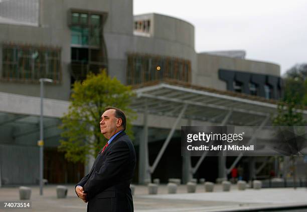 Alex Salmond leader of the SNP gives television interviews outside the Scottish Parliament building after the party won the Scottish Parliamentary...