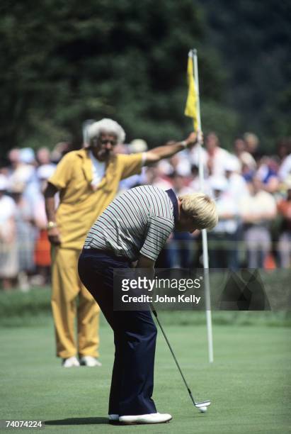 Jack Nicklaus putts toward his caddy Angelo Argea during the 1980 US Open at the Baltusrol Golf Club.