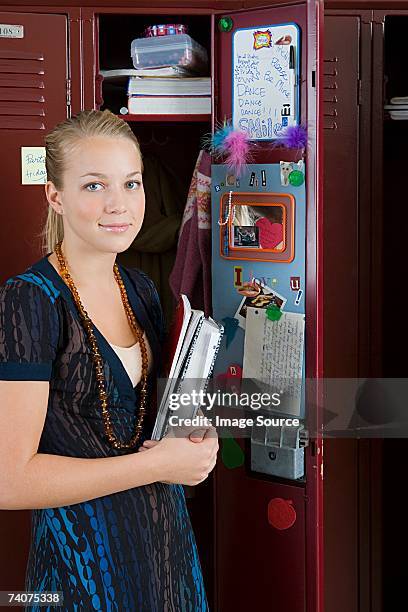girl by her locker - inside locker stock pictures, royalty-free photos & images