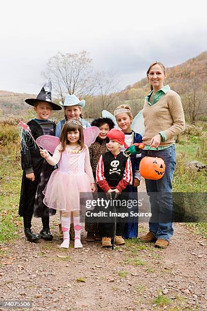 woman and children in halloween costumes - princess pirates stock pictures, royalty-free photos & images