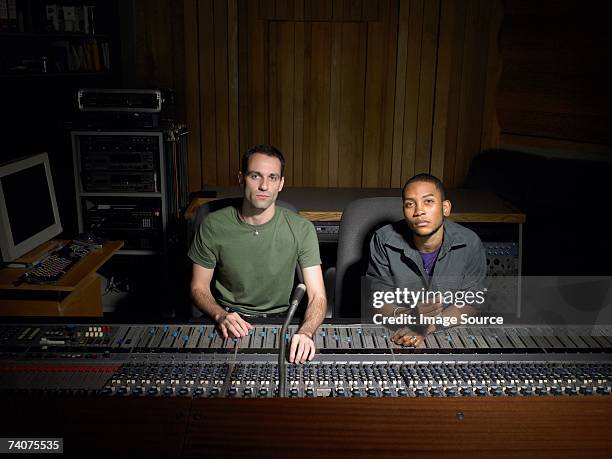 two music producers using mixing desk - sound producer stock pictures, royalty-free photos & images