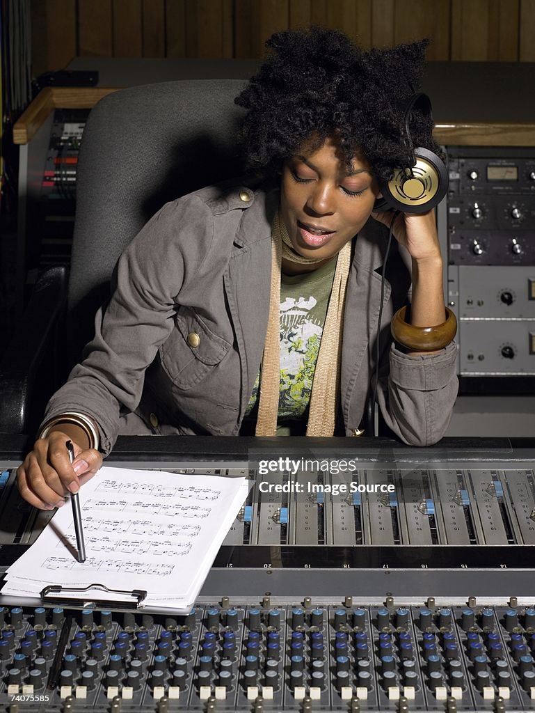 Music producer listening to music