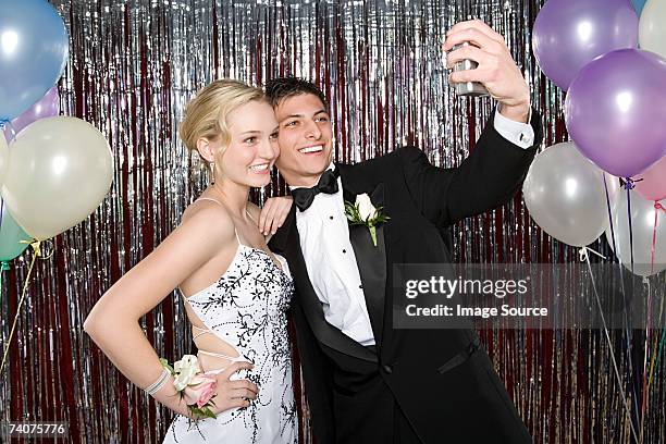 teenage boy and girl taking a picture at prom - prom bildbanksfoton och bilder