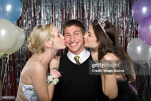 boy being kissed by two girls - boy tiara stock pictures, royalty-free photos & images
