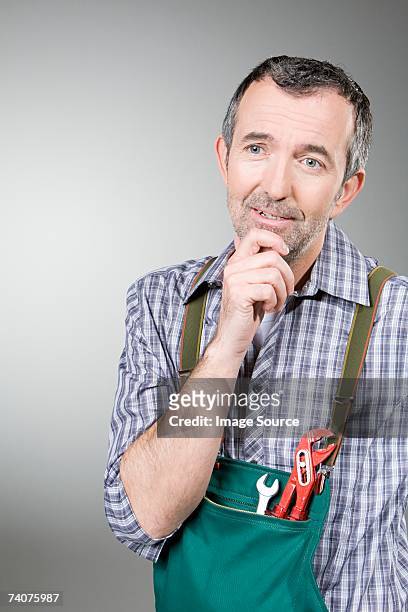 handyman thinking - handyman overalls stock pictures, royalty-free photos & images
