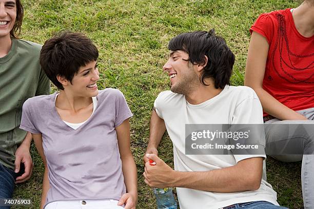 young man and woman laughing - girl flirting stock pictures, royalty-free photos & images