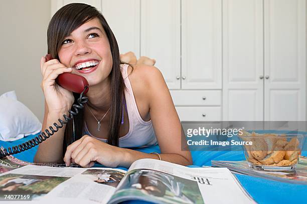 teenage girl using telephone - landline phone home stock pictures, royalty-free photos & images