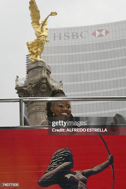 Zahra Redwood, Miss Jamaica 2007, passes in front of the Angel de la Independencia monument during a tour around Mexico City in the 'Turibus' 04 May...