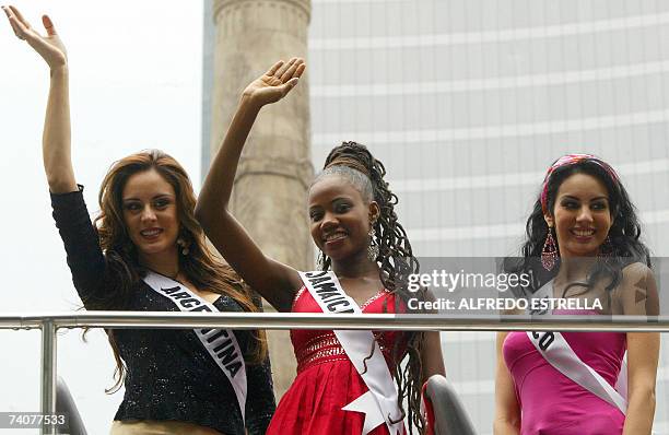 Daniela Stucan, Miss Argentina 2007; Zahra Redwood, Miss Jamaica 2007 and Rosa Maria Ojeda, Miss Mexico 2007 wave to photographers as they pass next...