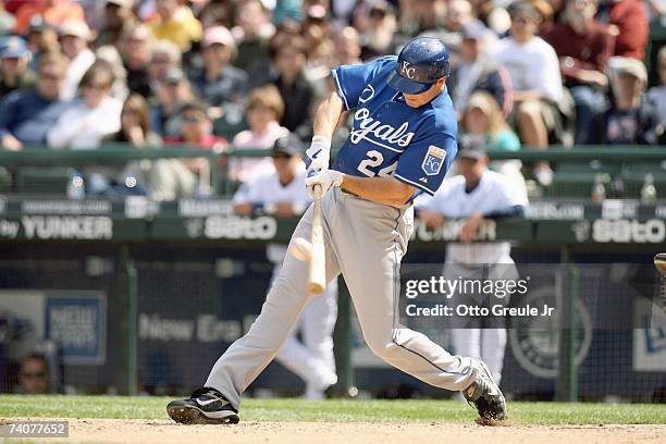 Mark Teahen of the Kansas City Royals connects with the pitch against the Seattle Mariners on April 29, 2007 at Safeco Field in Seattle, Washington....
