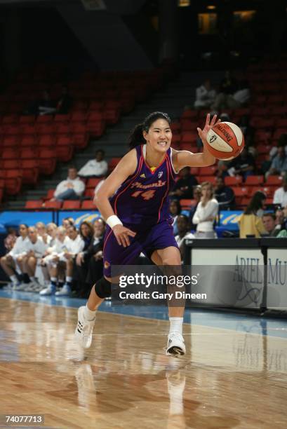 Kwe-Ryong Kim of the Phoenix Mercury moves the ball against the Chicago Sky during the preseason WNBA game on May 2, 2007 at UIC Pavilion in Chicago,...