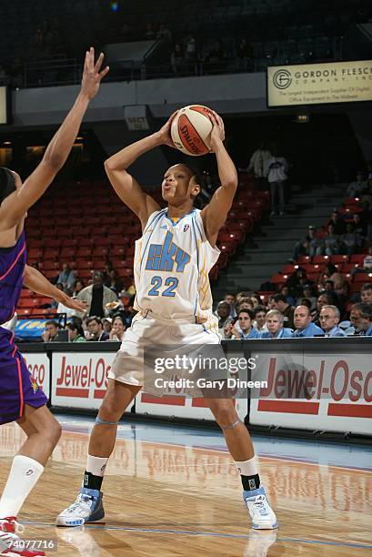 Armintie Price of the Chicago Sky moves the ball against the Phoenix Mercury during the preseason WNBA game on May 2, 2007 at UIC Pavilion in...