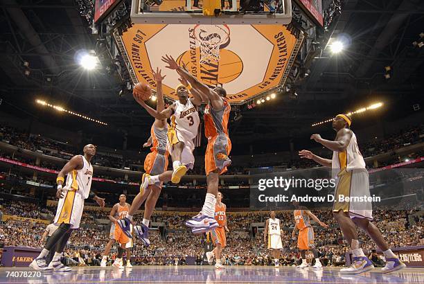 Shammond Williams of the Los Angeles Lakers goes to the basket against Amare Stoudemire of the Phoenix Suns in Game Four of the Western Conference...