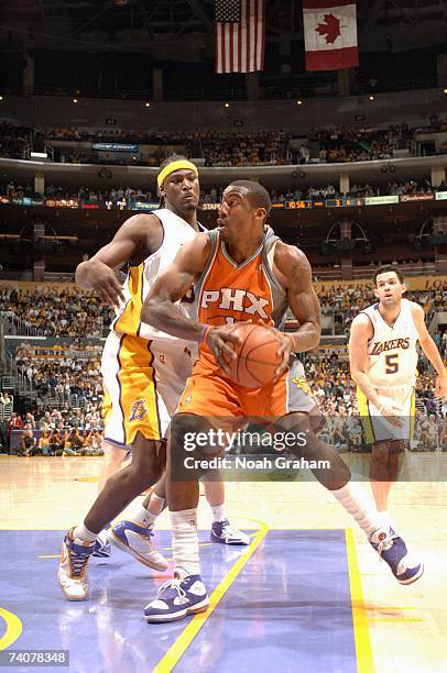Amare Stoudemire of the Phoenix Suns goes to the basket against Kwame Brown of the Los Angeles Lakers in Game Four of the Western Conference...