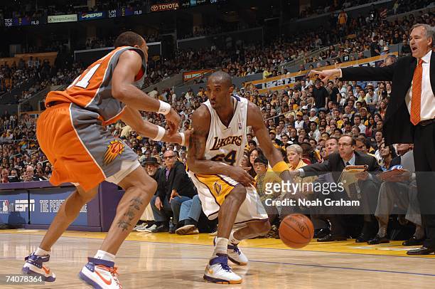 Kobe Bryant of the Los Angeles Lakers dribbles against Shawn Marion of the Phoenix Suns in Game Four of the Western Conference Quarterfinals during...