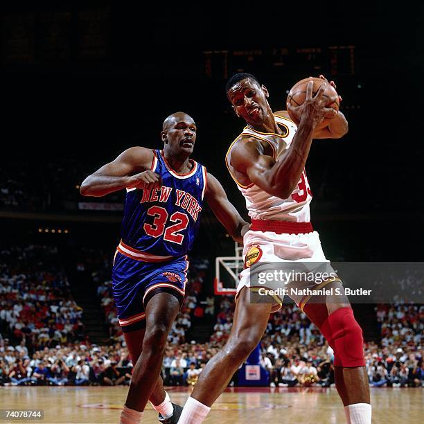 Otis Thorpe of the Houston Rockets secures the rebound against Herb Williams of the New York Knicks during Game One of the NBA Finals played on June...