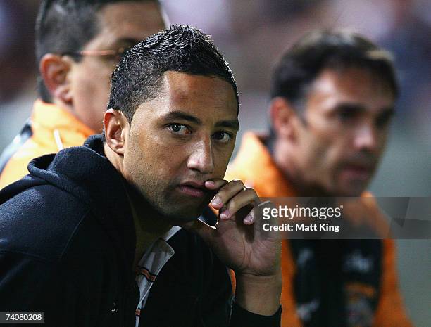 Benji Marshall of the Tigers sits on the bench with an injury during the round eight NRL match between the Wests Tigers and the Melbourne Storm at...
