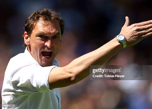 Osnabruecks coach Claus-Dieter Wollitz gestures during the Third League match between VFL Osnabrueck and FC St.Pauli at the Osnatel Arena on May 5,...