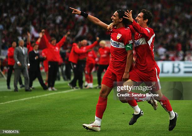 Fernando Meira of Stuttgart celebrates with his team mate Roberto Hilbert after scoring the opneing goal during the Bundesliga match between VfB...