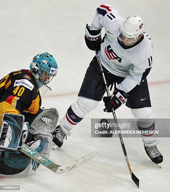 Paul Stastny attacks German goalie Dimitri Patzold during their qualifying round group F game of the IIHF International Ice Hockey World Championship...