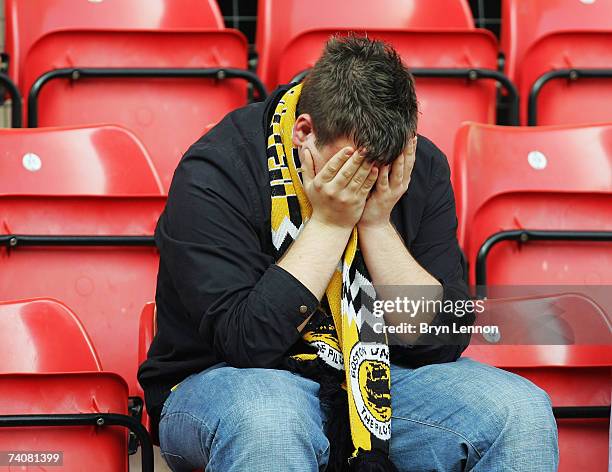 Dejected Boston United fan reacts to being knocked out of the football league during Coca-Cola Football League Two game between Wrexham and Boston...