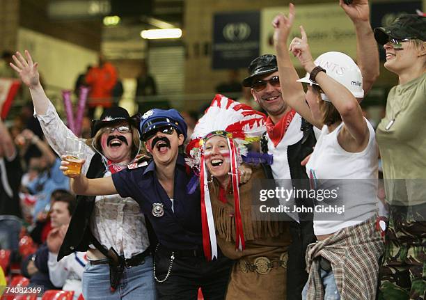 Saints fans dressed as the "Village People" celebrate their teams victory during the Engage Super League match between St.Helens and Wigan Warriors...