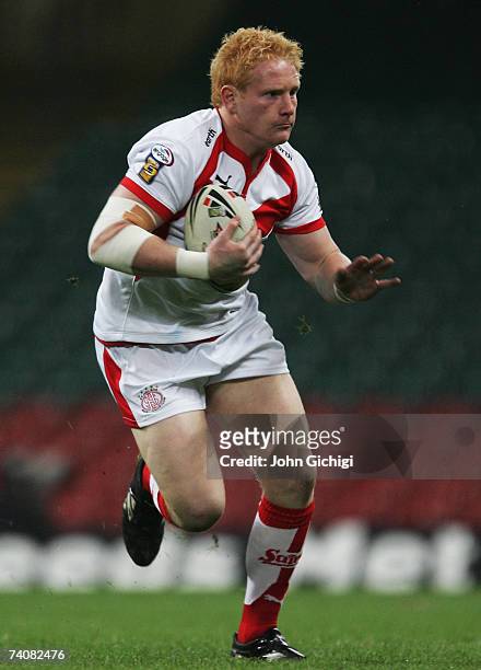 James Graham of Saints runs with the ball during the Engage Super League match between St.Helens and Wigan Warriors at the Millennium Stadium on May...