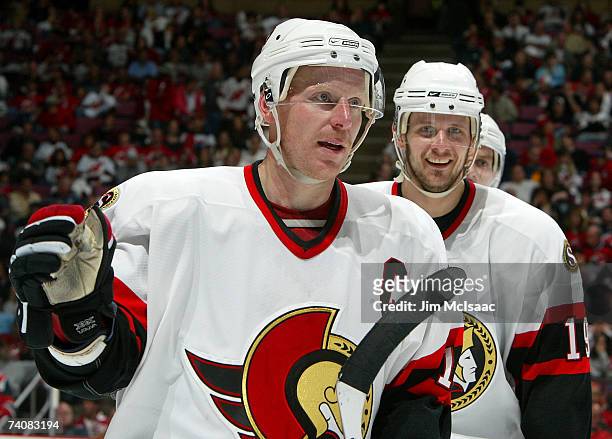 Daniel Alfredsson of the Ottawa Senators celebrates his second-period goal with teammate Jason Spezza against the New Jersey Devils during Game Five...